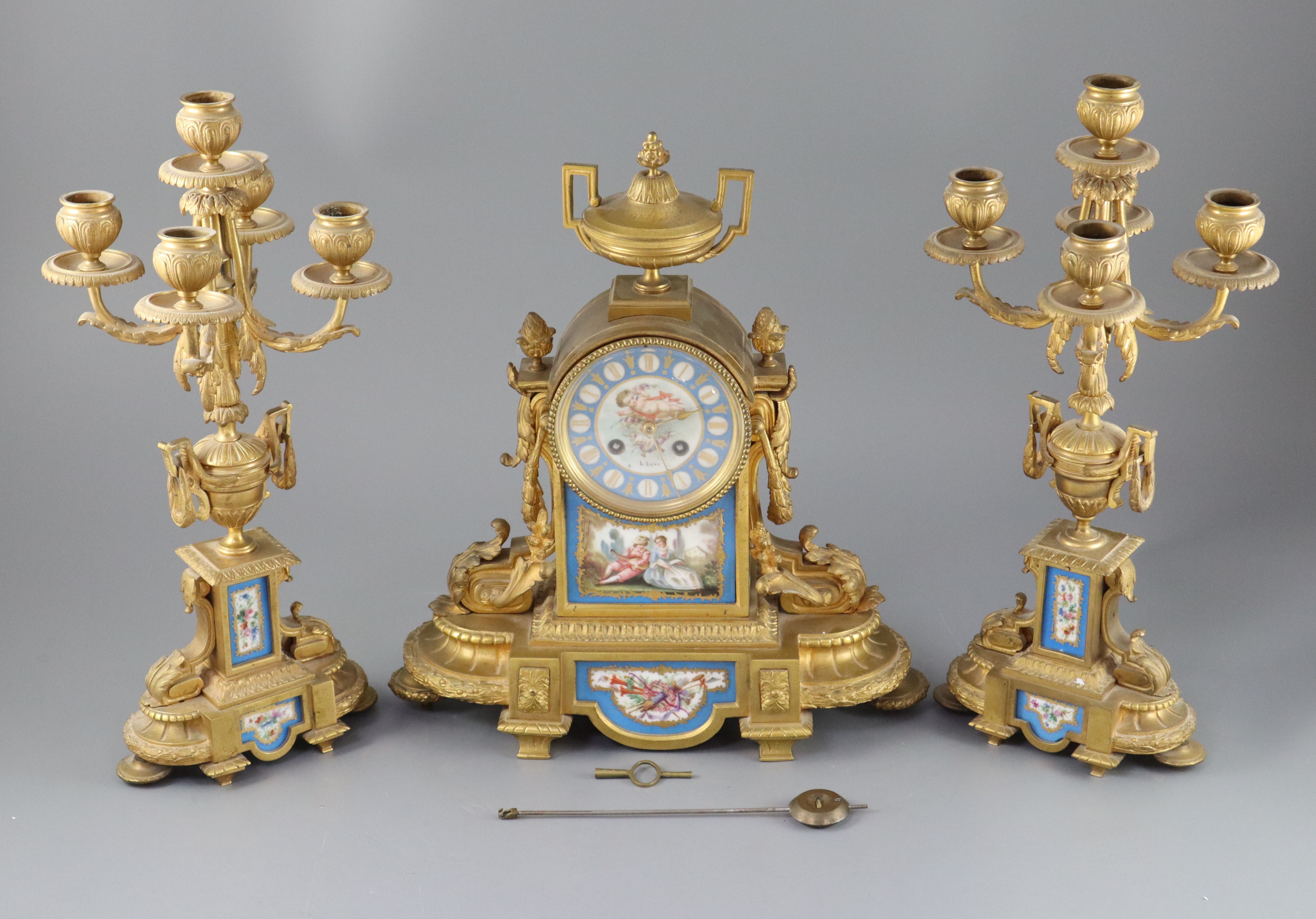 A 19th century Louis XVI style ormolu and Sevres style porcelain clock garniture, height 16.5in.